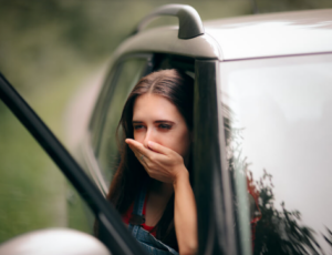 motion sickness - woman with car sickness